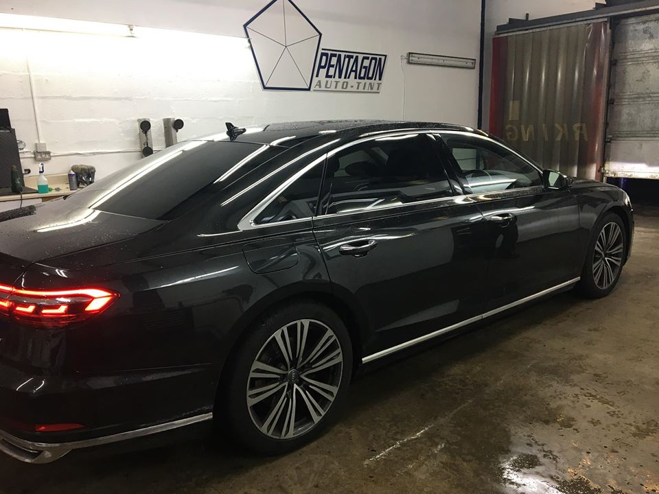 Black car inside the shop garage