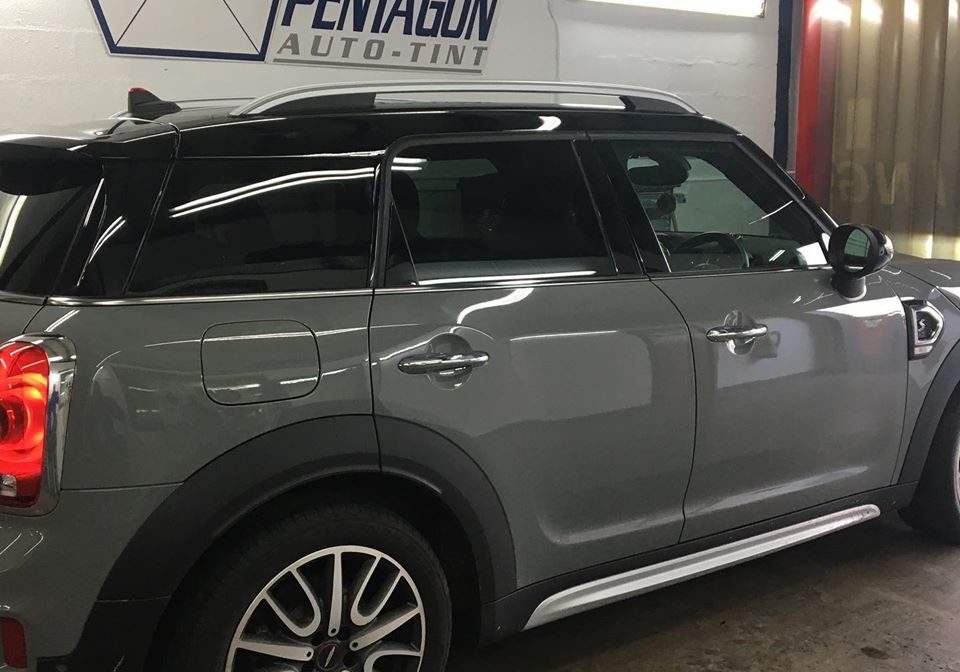 Grey car inside the shop garage